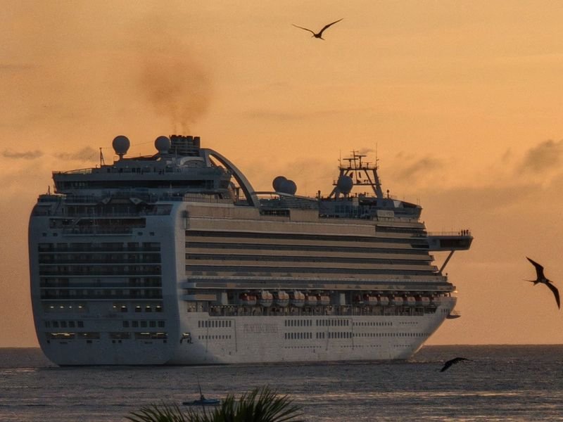 A cruise ship on the sea at sunset