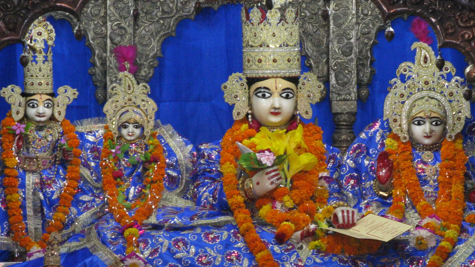 Idols of Lord Rama and Sita adorned with crowns and flowers at Kanak Bhawan in Ayodhya