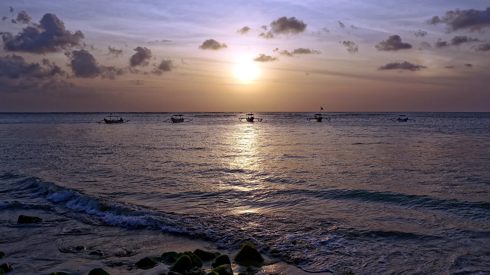 Sunset over the beach at Kuta on Bali's west coast, the classic way to end a day by the sea