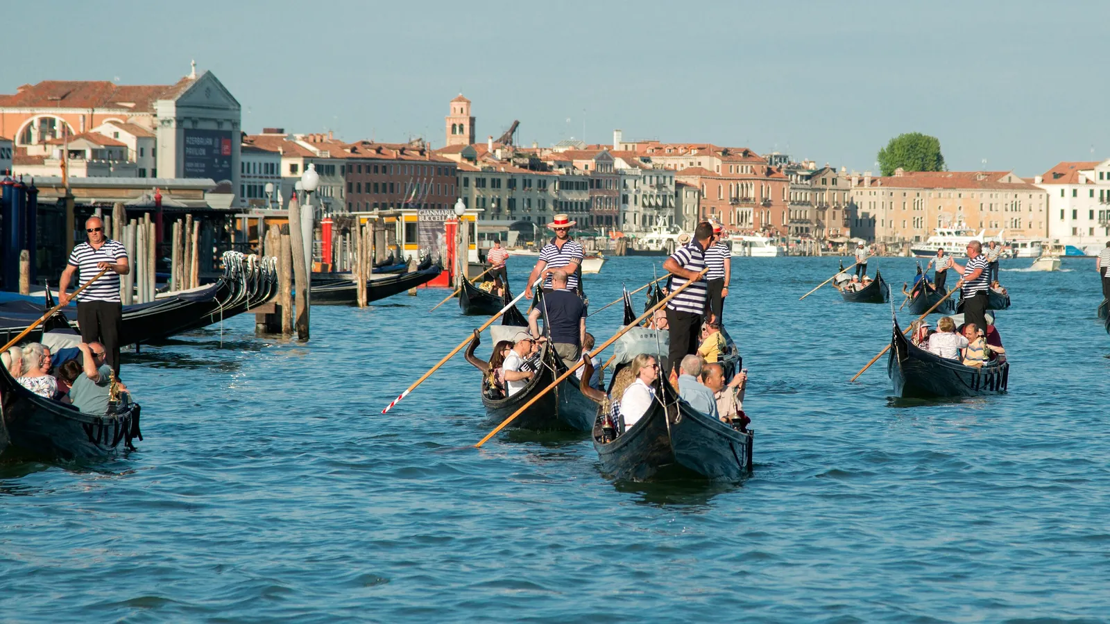 Gondolas glide along the Grand Canal in Venice, where the 14-day route explores by vaporetto water bus