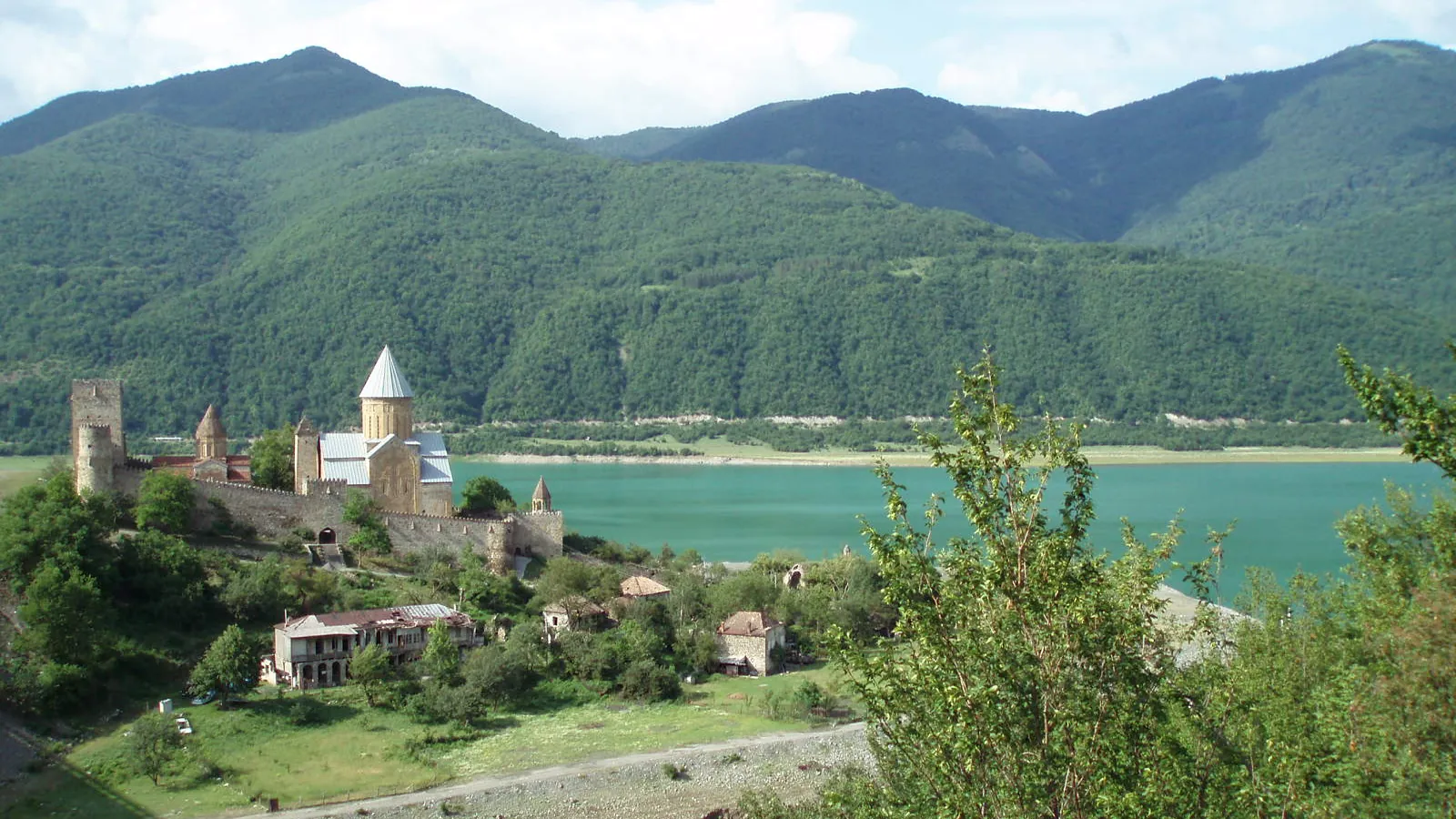 The Ananuri fortress beside the turquoise Zhinvali reservoir on the Georgian Military Road