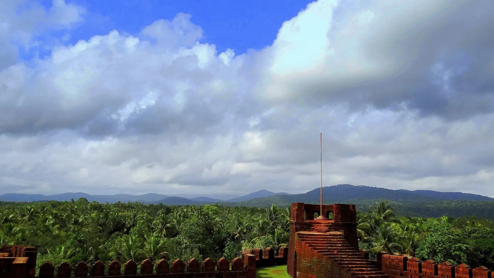 The laterite walls of Mirjan Fort above the forest near Gokarna