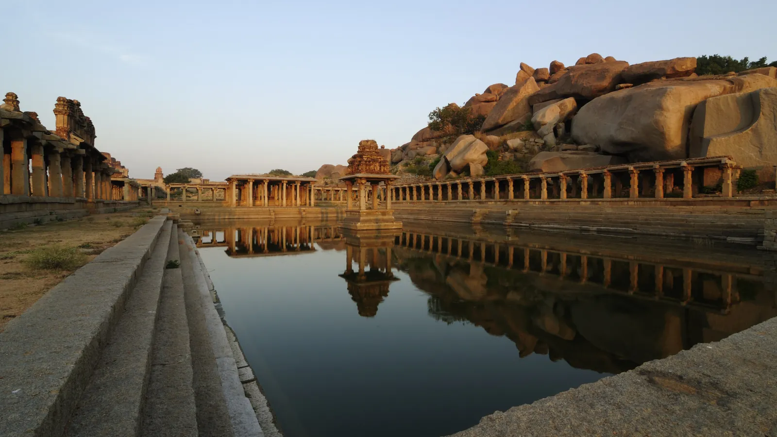 The stepped Krishna Pushkarani tank among the ruins of Hampi