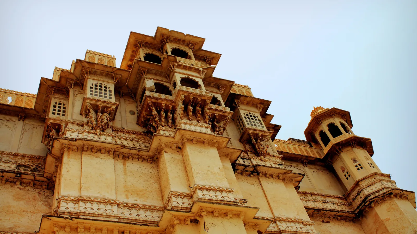 The ornate sandstone facade of the City Palace in Udaipur