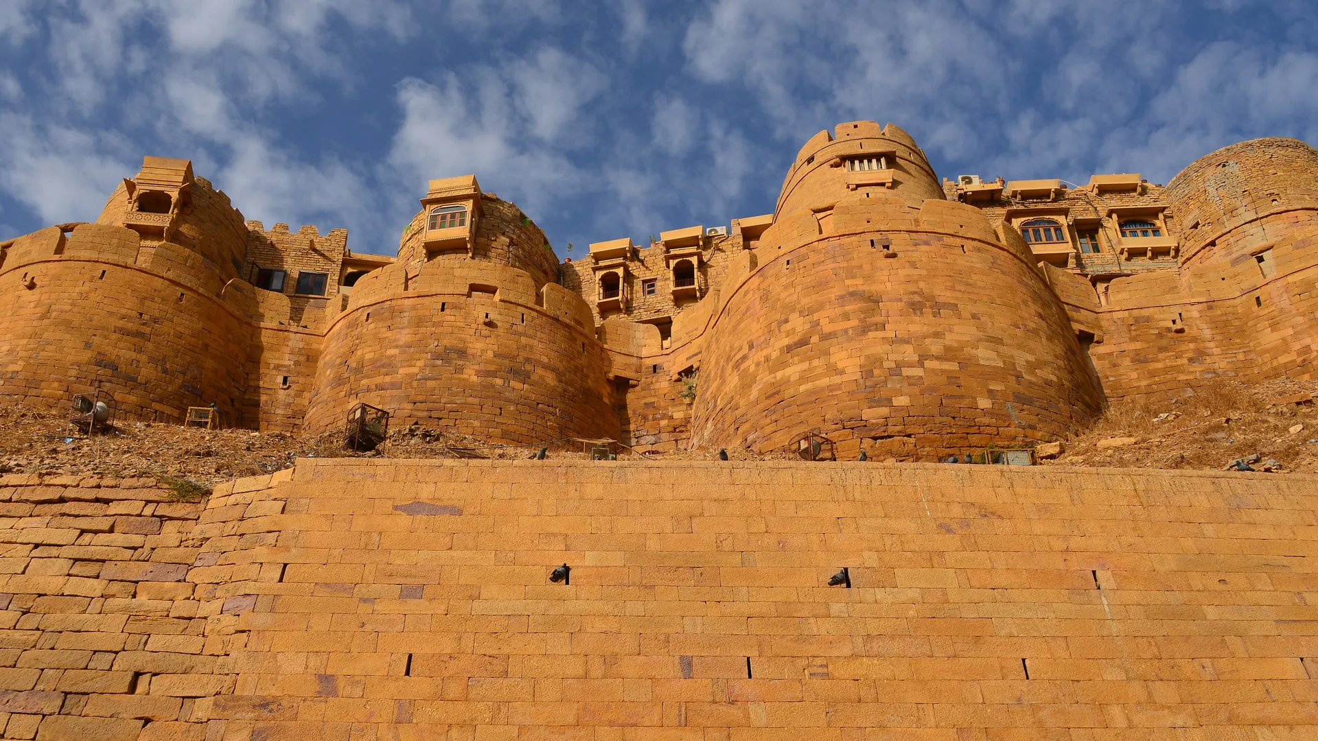 The golden sandstone walls and bastions of Jaisalmer Fort, a living fort in the Thar Desert