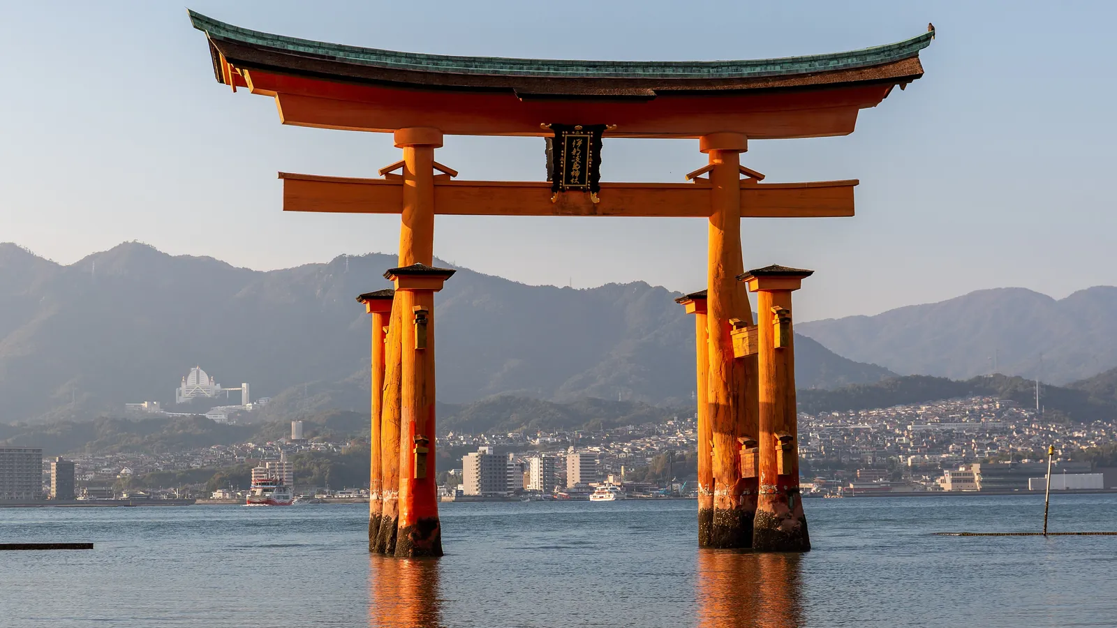 The great vermilion torii of Itsukushima Shrine rises from the sea at Miyajima, a UNESCO World Heritage Site near Hiroshima
