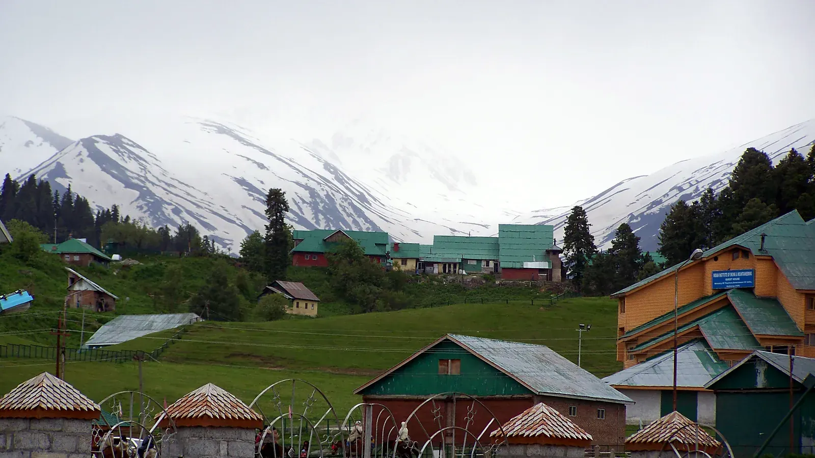 The meadows of Gulmarg ringed by pine forest and snow peaks, often called heaven on earth