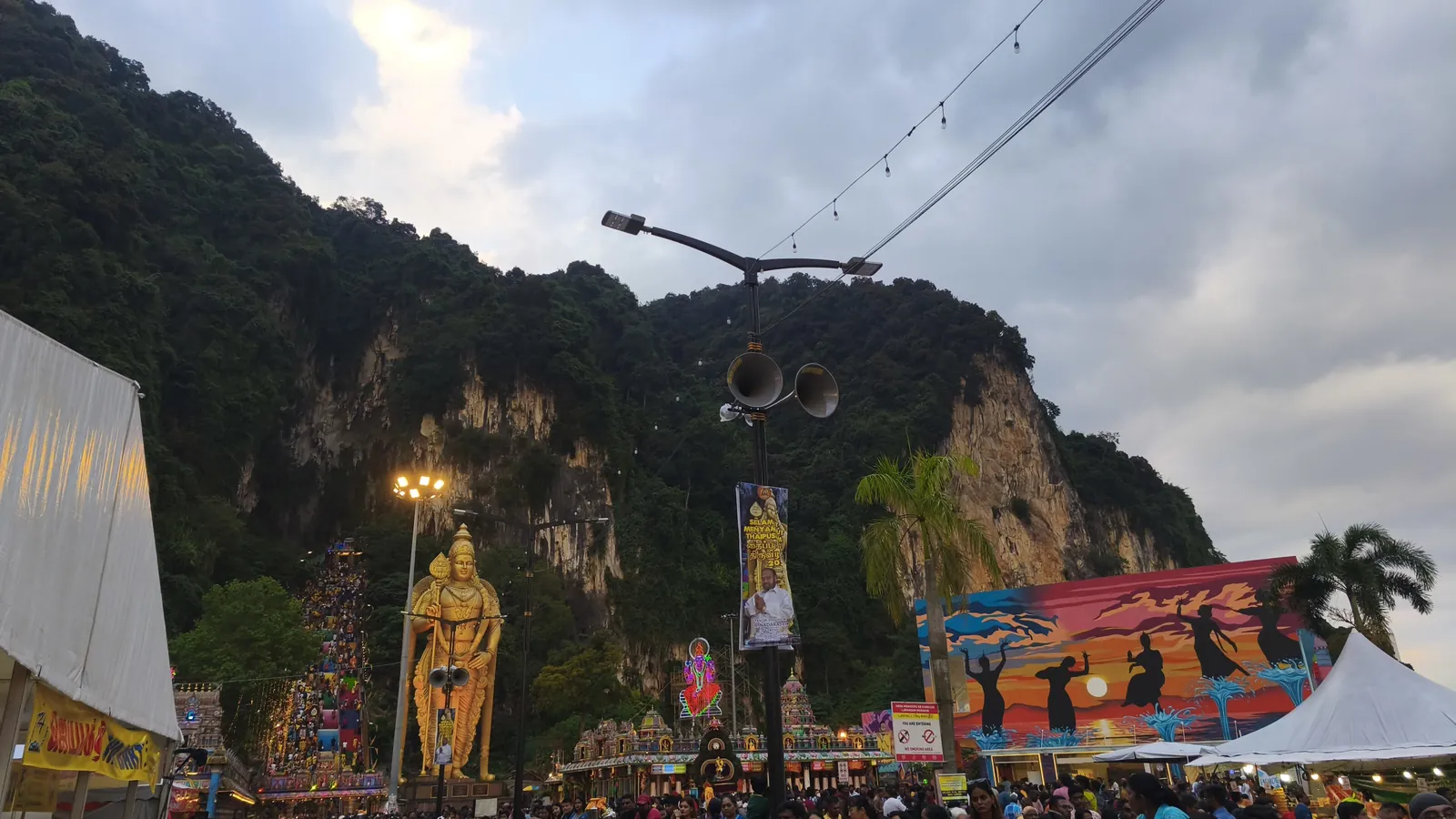 The golden statue of Lord Murugan and the colourful staircase at Batu Caves near Kuala Lumpur