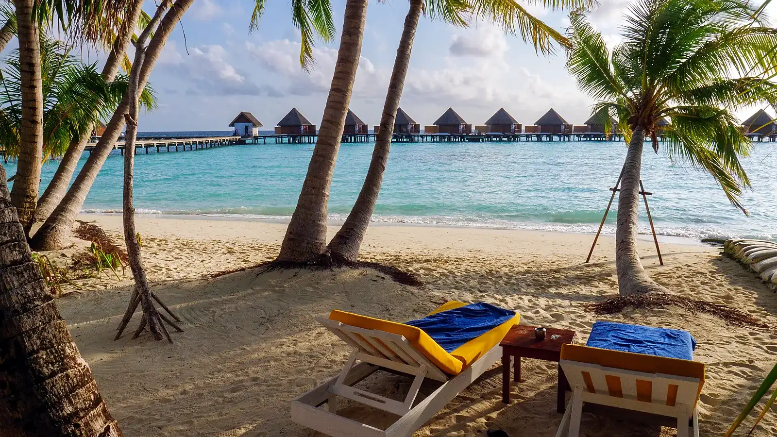 A resort beach in the Maldives, where the sand is powder-soft and the lagoon stays warm all year round