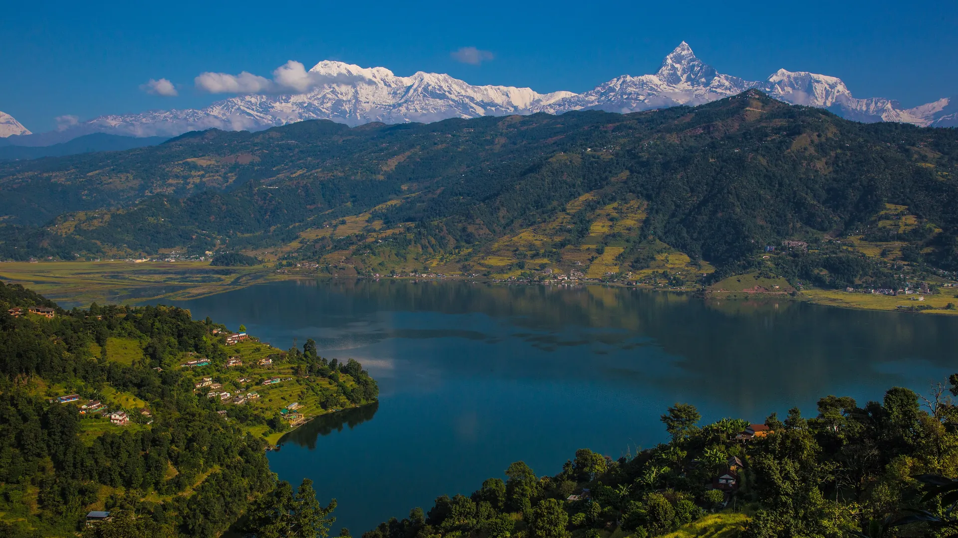 Phewa Lake in Pokhara with the Annapurna range and the peak of Machhapuchhre rising beyond