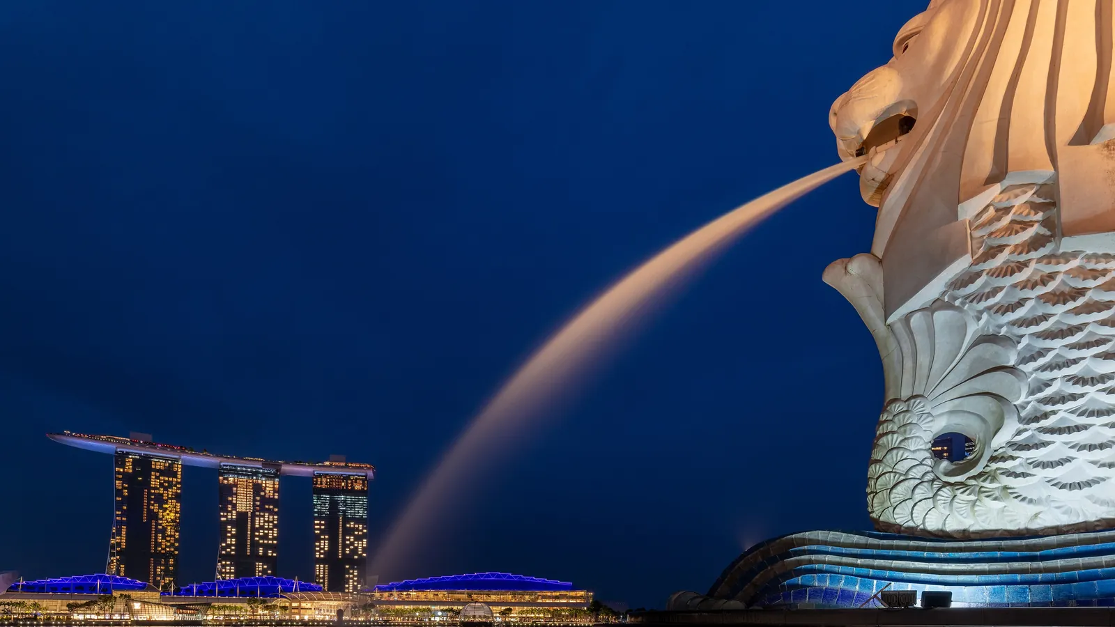 The Merlion statue spouts water in front of Marina Bay Sands in Singapore