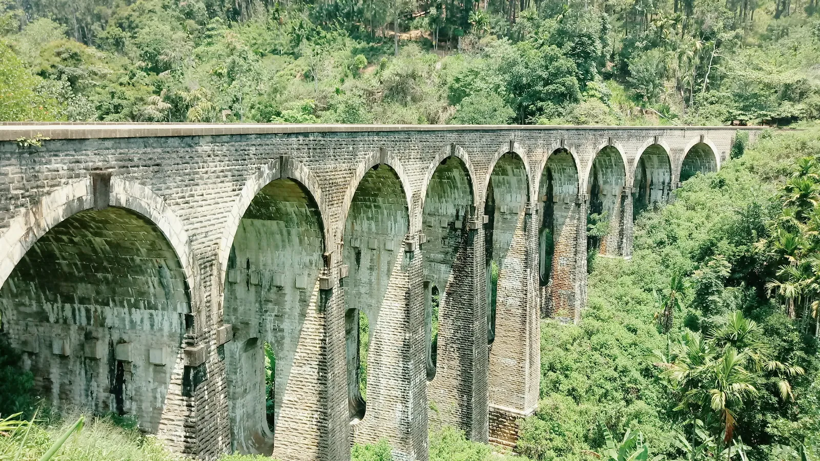 The Nine Arch Bridge near Ella, a colonial-era stone railway viaduct surrounded by jungle and tea country