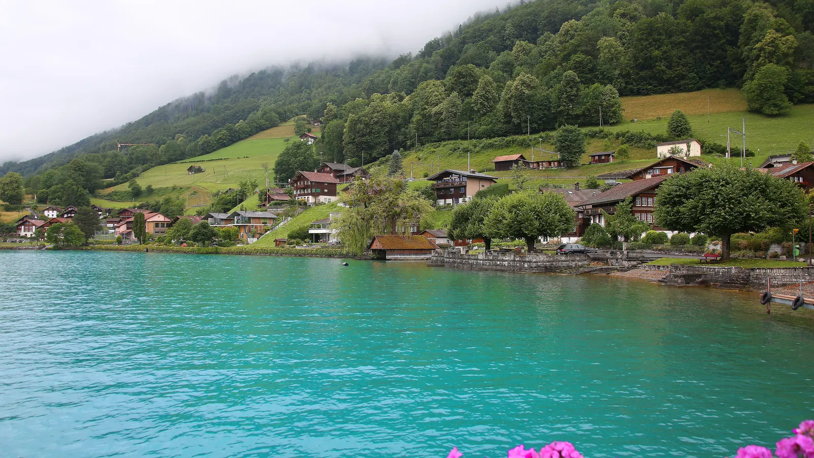 The turquoise water of Lake Brienz surrounded by mountains in central Switzerland