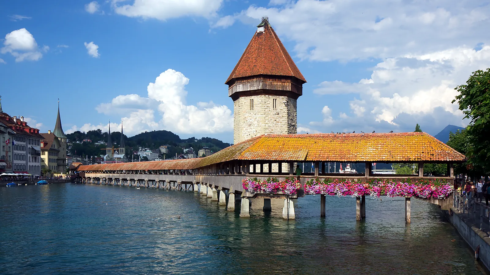 Lucerne's old town and the Chapel Bridge on the lakeshore, the perfect base for Mount Titlis, Pilatus and Rigi