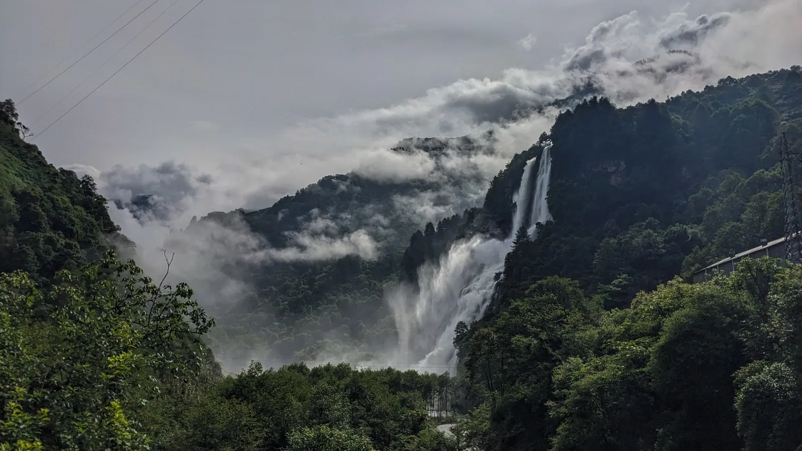 Nuranang Falls plunges through a forested gorge near Jang in Tawang district