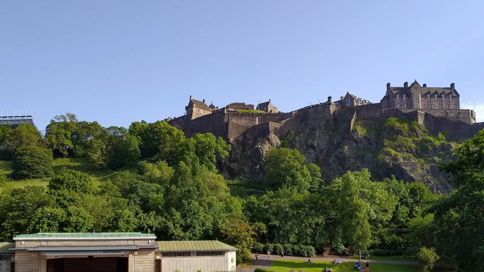 Edinburgh Castle rises above the gardens and rooftops of the Scottish capital on its volcanic Castle Rock
