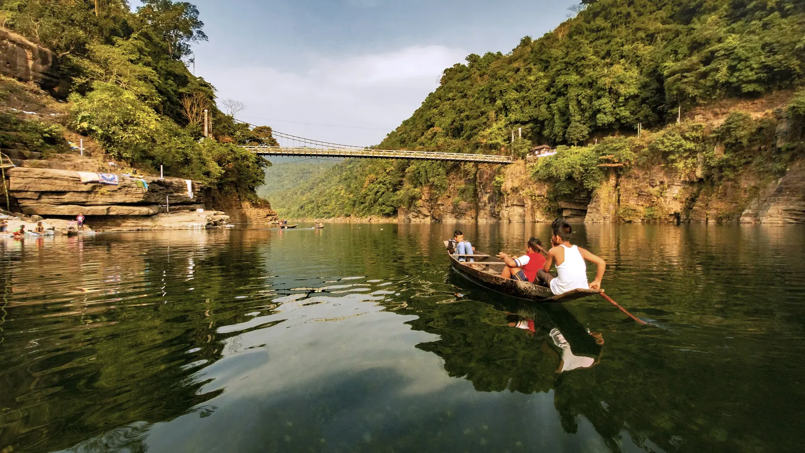 Boats on the crystal-clear Umngot River at Dawki in Meghalaya, where the water is so transparent that the riverbed shows through