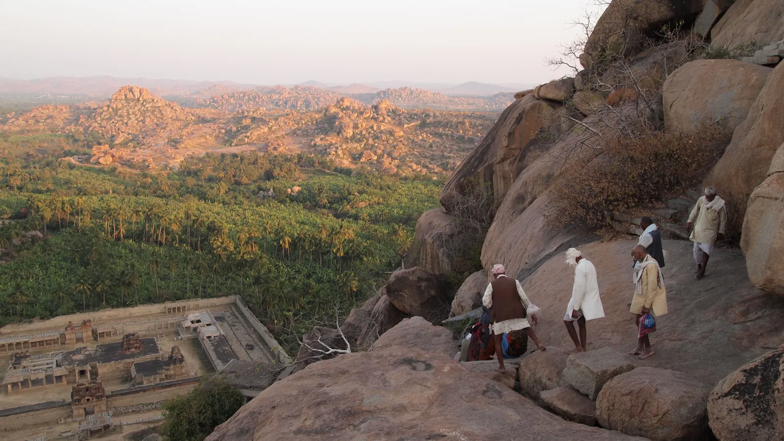 Sunset from Matanga Hill over Hampi's landscape of giant granite boulders and ruined temples in Karnataka