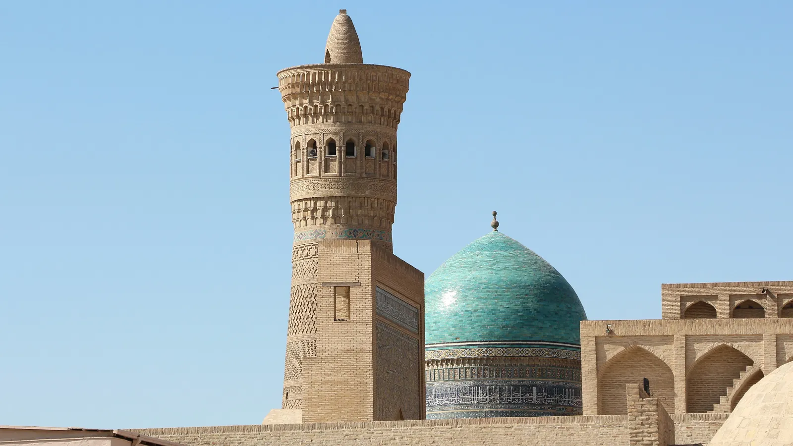 The Kalyan Minaret and the turquoise dome of the Mir-i-Arab Madrasa in Bukhara