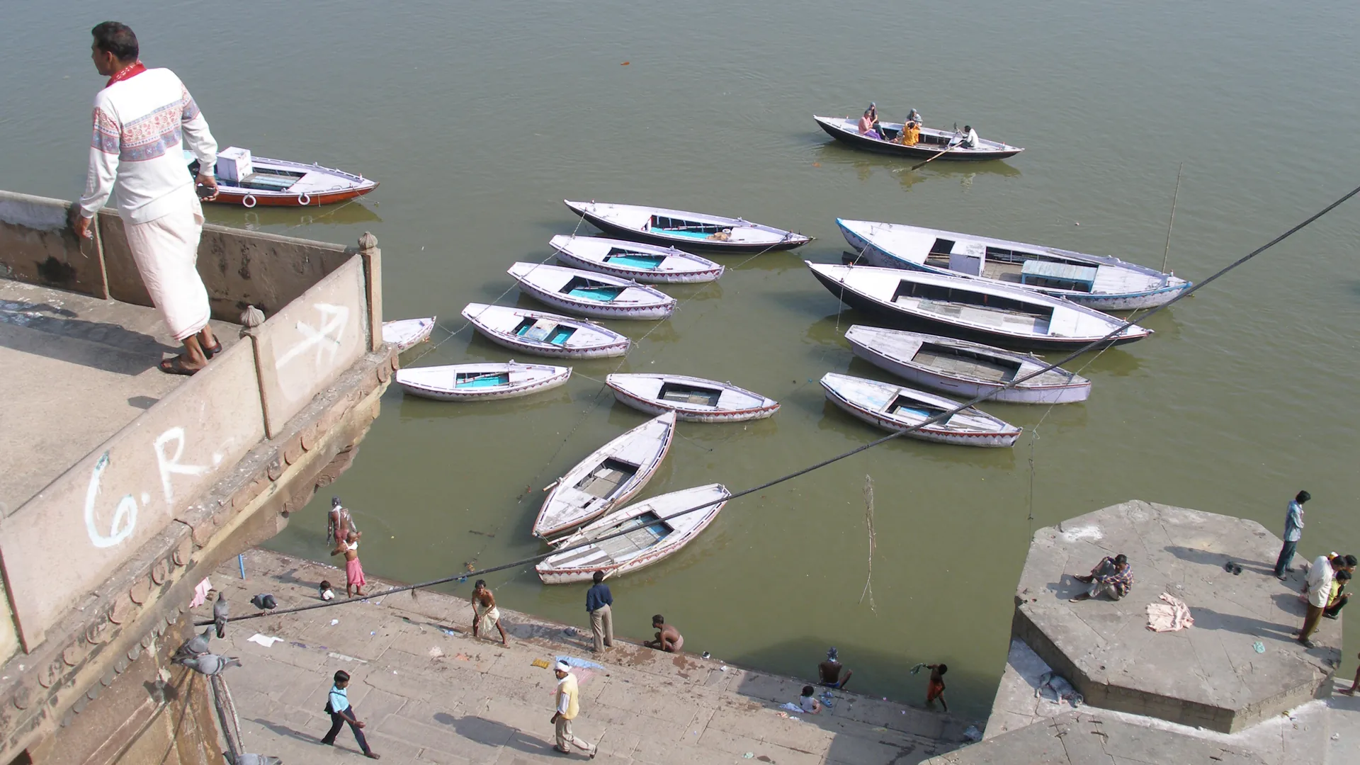 Boats on the Ganga in front of the ghats of Varanasi at sunrise