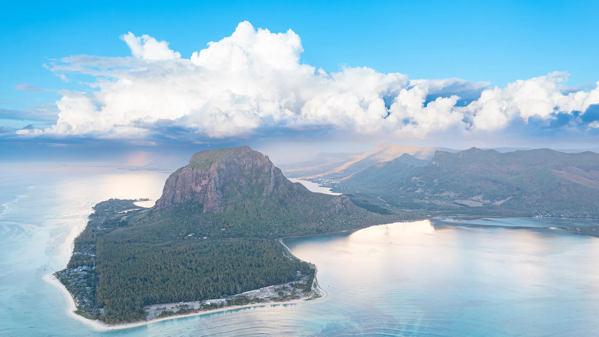 The Le Morne Brabant peninsula rises above a turquoise lagoon in Mauritius, one of the easiest island escapes for Indian passport holders